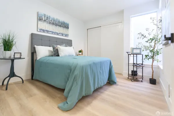 a bedroom with a bed and a table in it