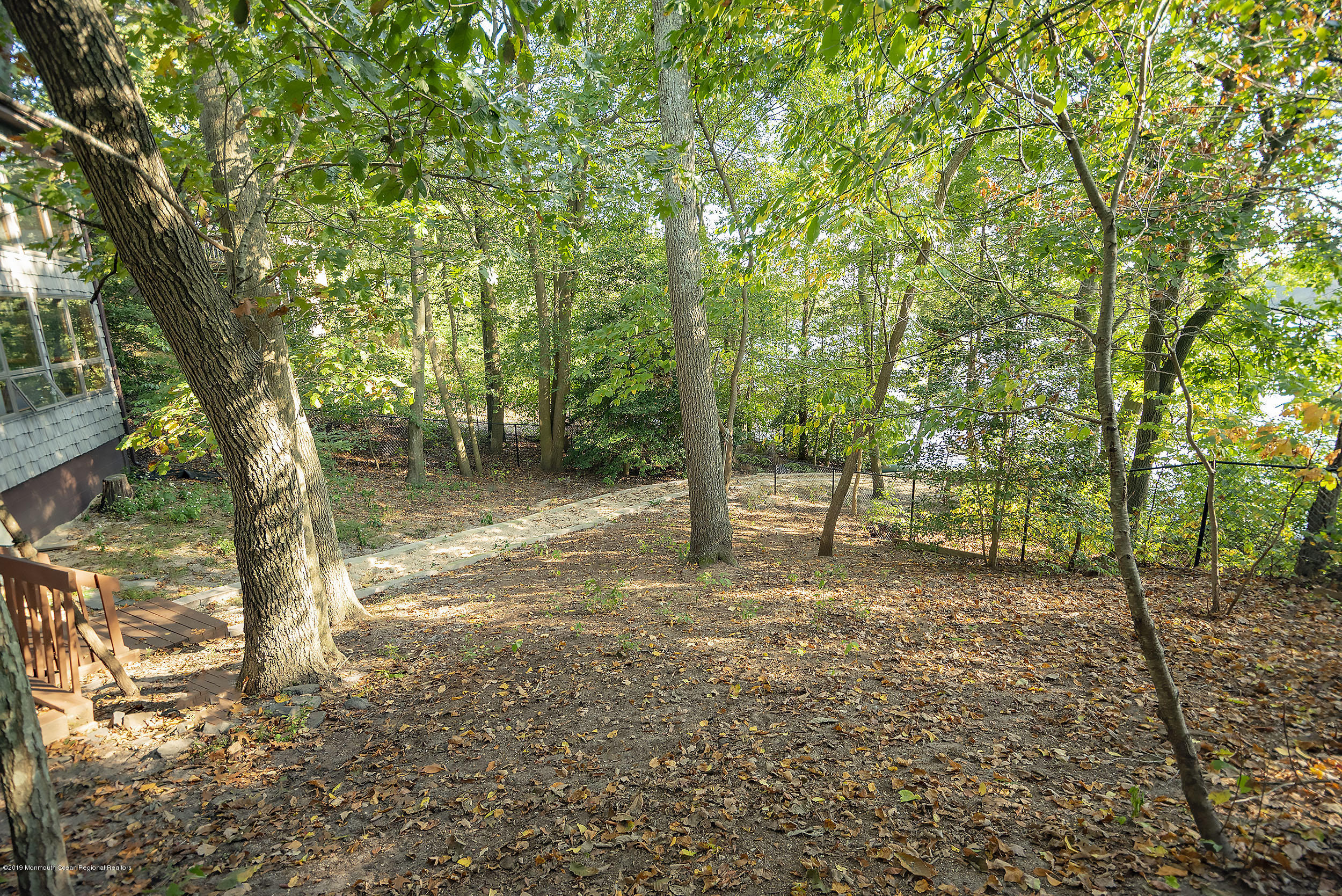 1719 Forge Pond Road Brick, NJ 08724 - Photo 22 of 43 a view of a tree in the middle of a yard