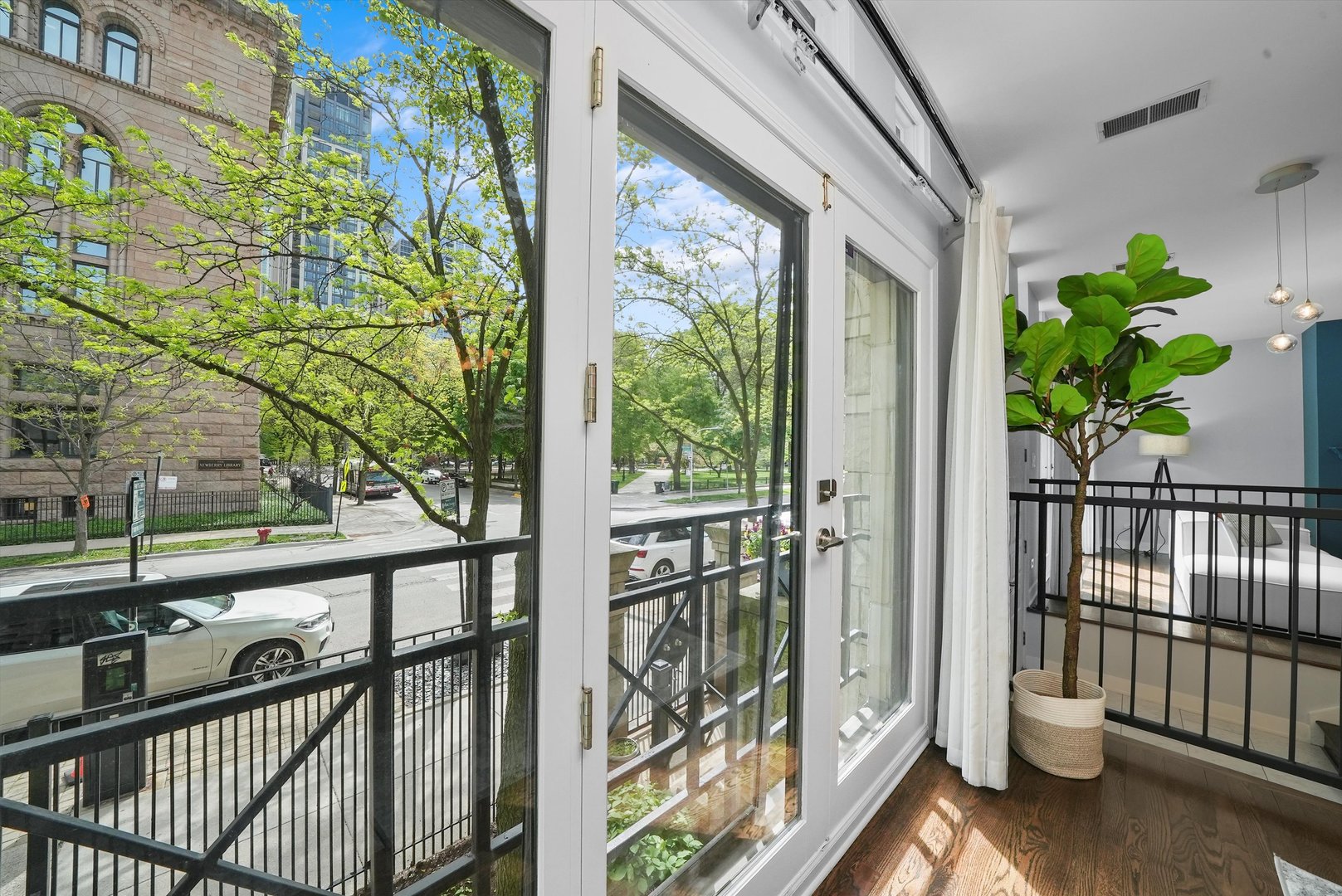 950 North Clark Street, Unit E Chicago, IL 60610 - Photo 14 of 52 a view of a porch with wooden floor