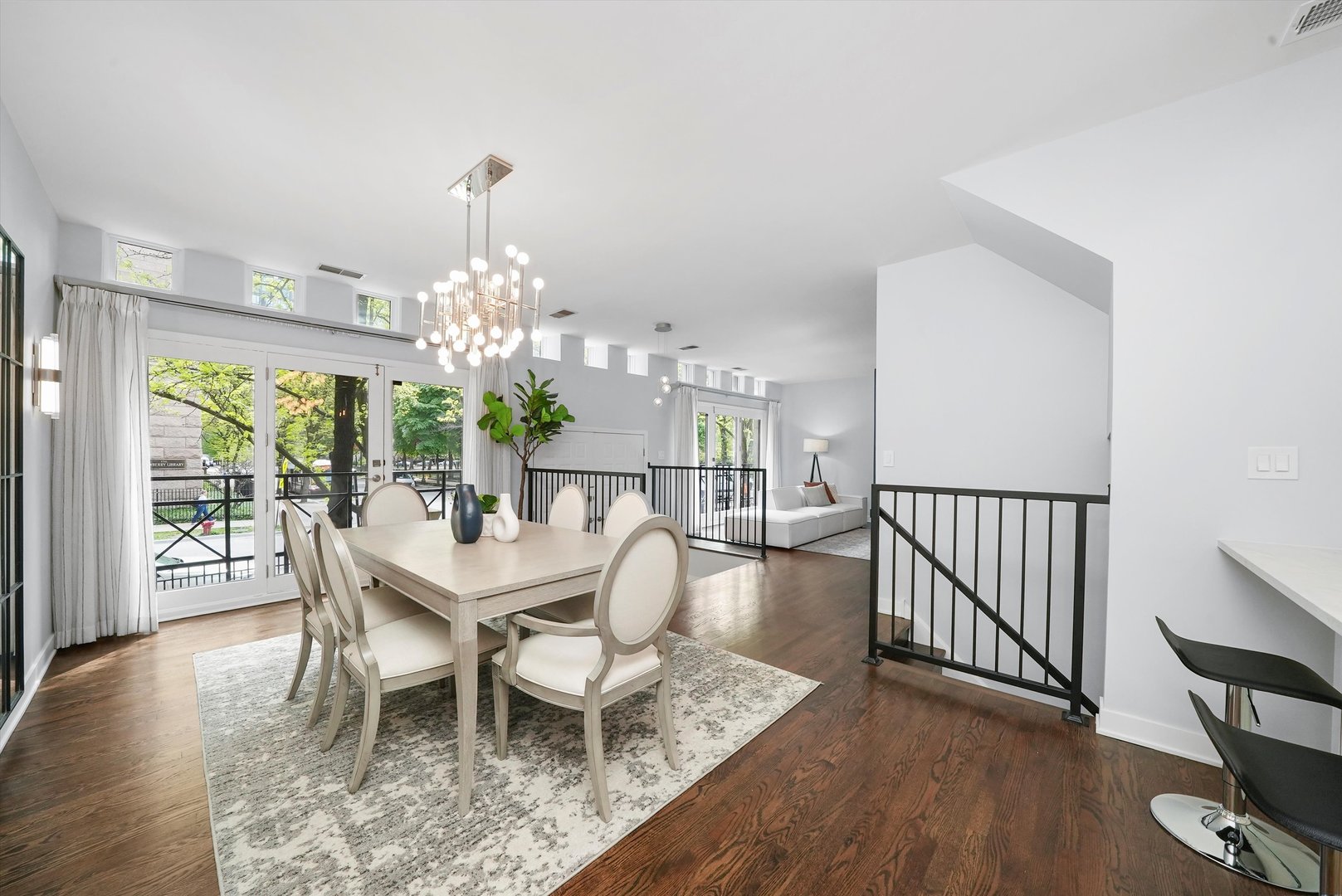 950 North Clark Street, Unit E Chicago, IL 60610 - Photo 15 of 52 a dining room with furniture a chandelier and wooden floor
