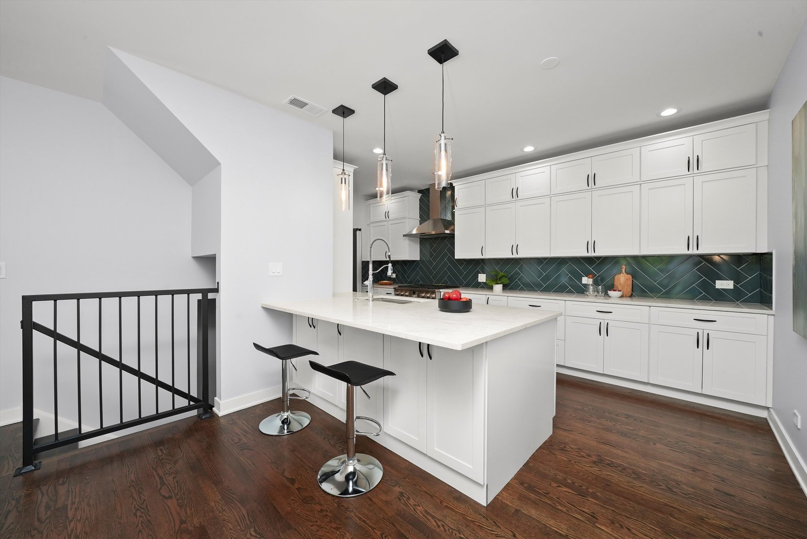 950 North Clark Street, Unit E Chicago, IL 60610 - Photo 17 of 52 a kitchen with stainless steel appliances granite countertop a stove a sink a refrigerator and white cabinets with wooden floor
