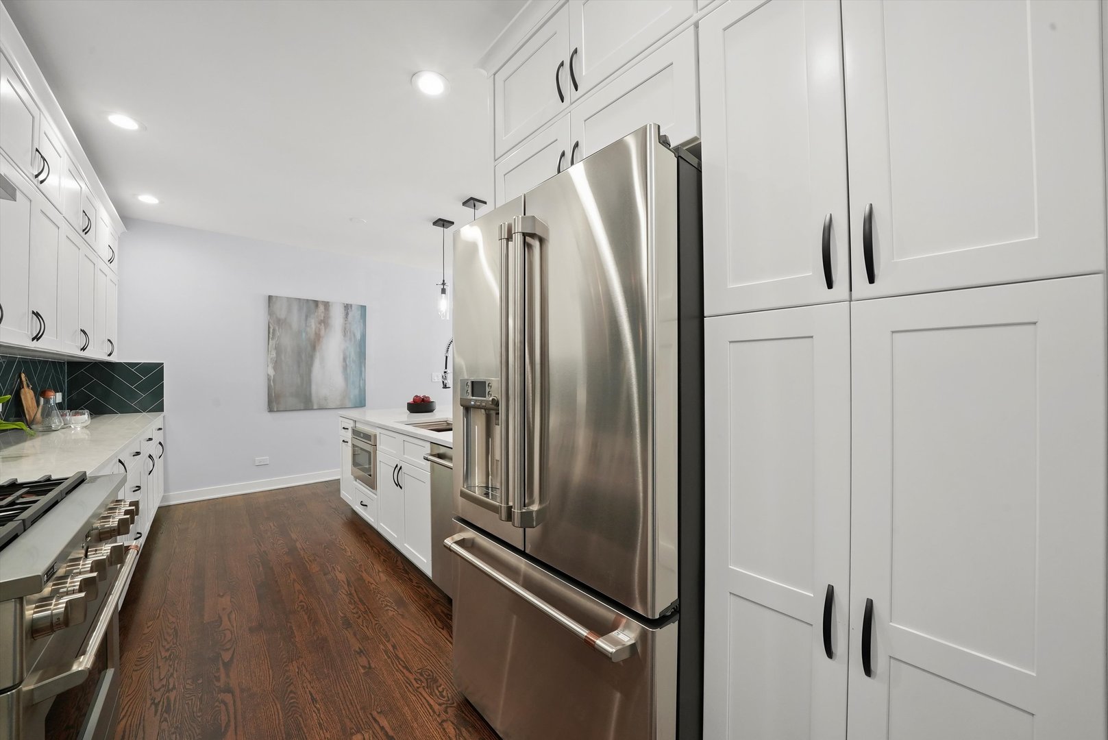 950 North Clark Street, Unit E Chicago, IL 60610 - Photo 22 of 52 a kitchen with stainless steel appliances a refrigerator and a stove top oven