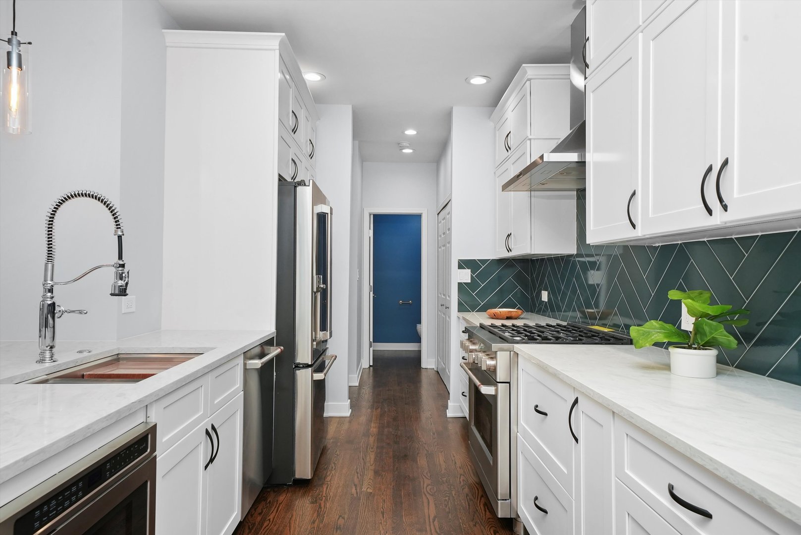 950 North Clark Street, Unit E Chicago, IL 60610 - Photo 24 of 52 a kitchen with stainless steel appliances granite countertop a sink a stove and a refrigerator