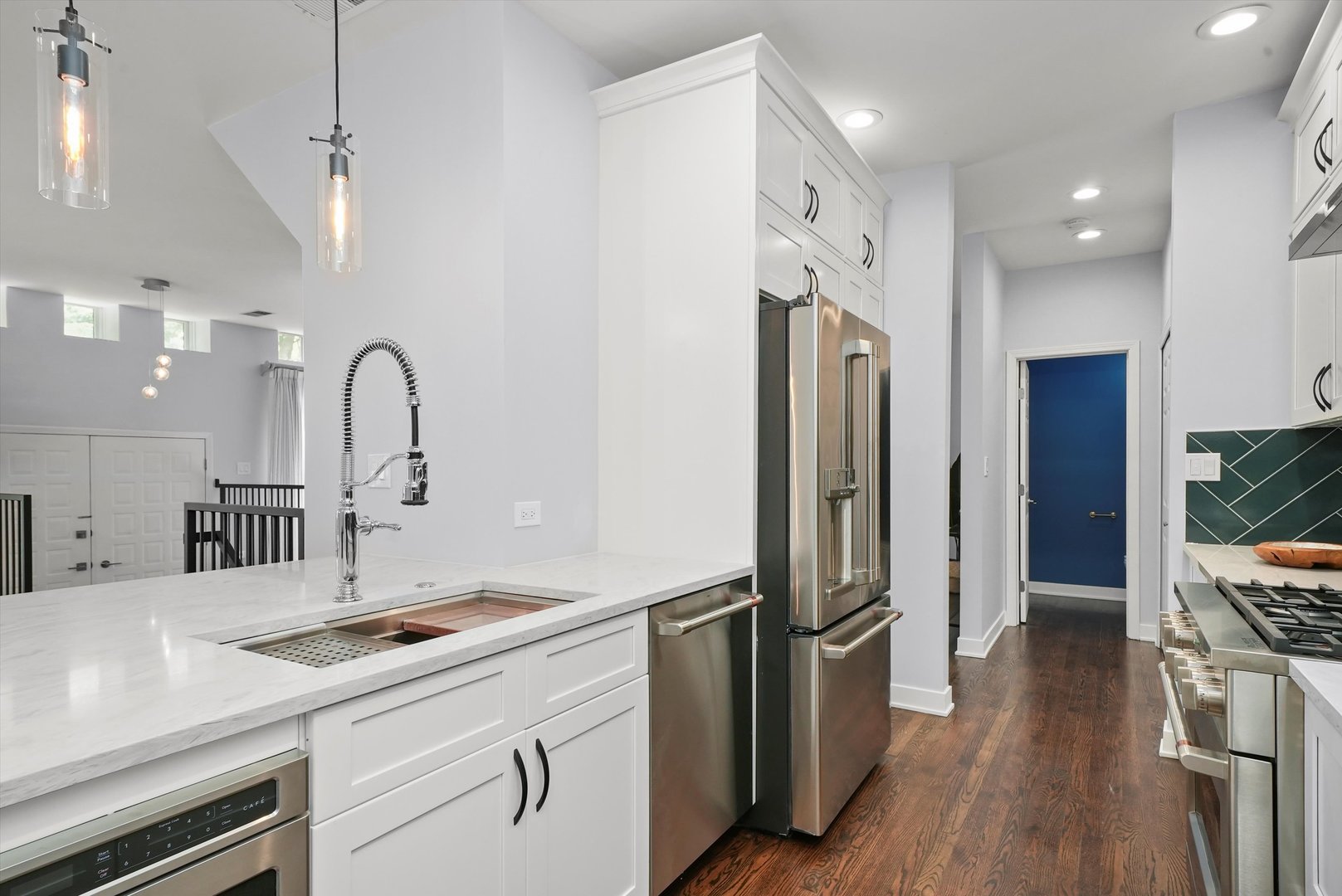 950 North Clark Street, Unit E Chicago, IL 60610 - Photo 25 of 52 a kitchen with a refrigerator and a sink