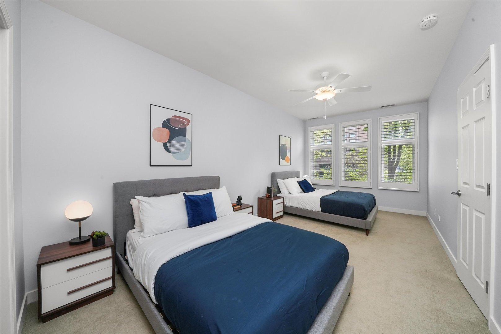 950 North Clark Street, Unit E Chicago, IL 60610 - Photo 29 of 52 a bedroom with furniture and a large window