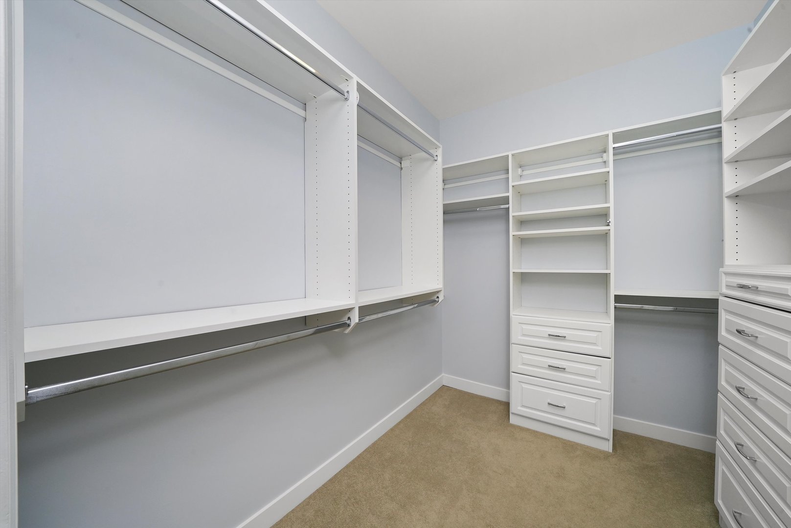 950 North Clark Street, Unit E Chicago, IL 60610 - Photo 30 of 52 a view of walk in closet with clothes