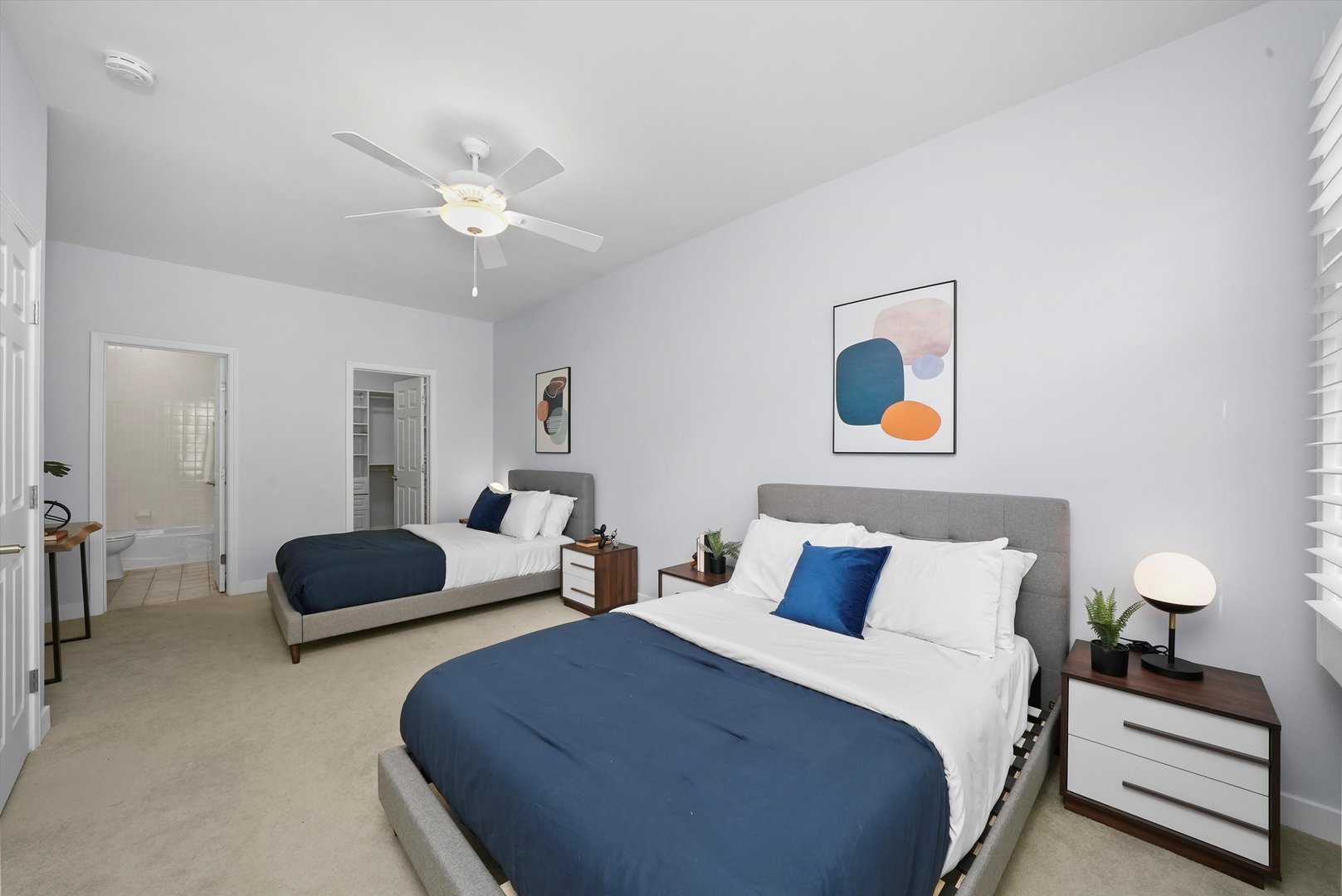 950 North Clark Street, Unit E Chicago, IL 60610 - Photo 31 of 52 a bedroom with a bed and a chandelier