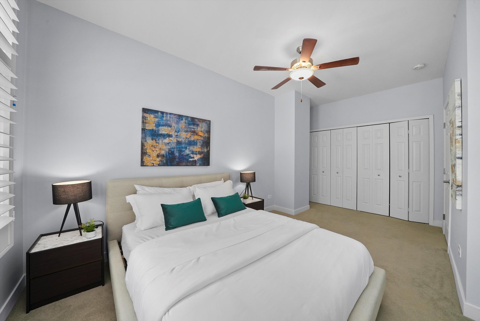 950 North Clark Street, Unit E Chicago, IL 60610 - Photo 34 of 52 a bedroom with a bed and a chandelier