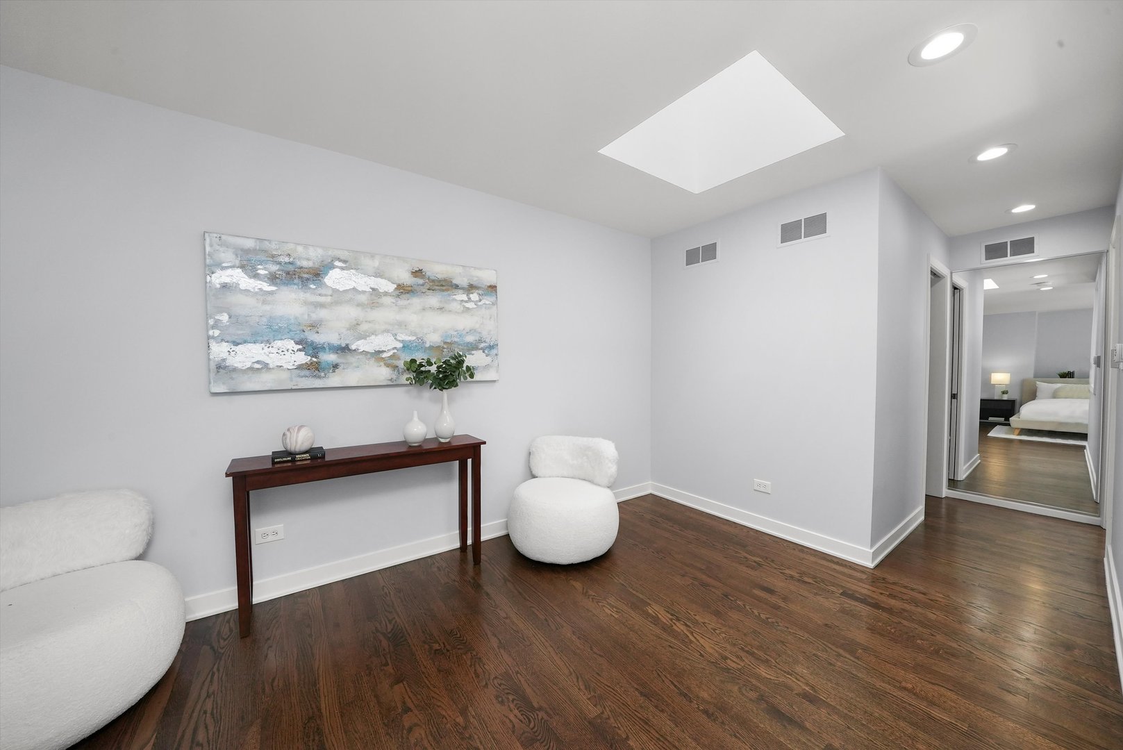 950 North Clark Street, Unit E Chicago, IL 60610 - Photo 38 of 52 a living room with furniture and wooden floor