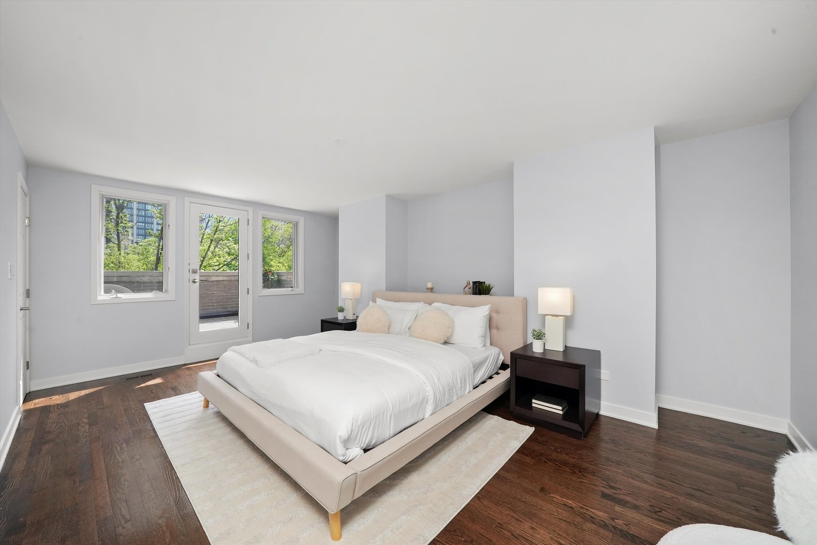 950 North Clark Street, Unit E Chicago, IL 60610 - Photo 39 of 52 a bedroom with a bed a lamp on table and a window