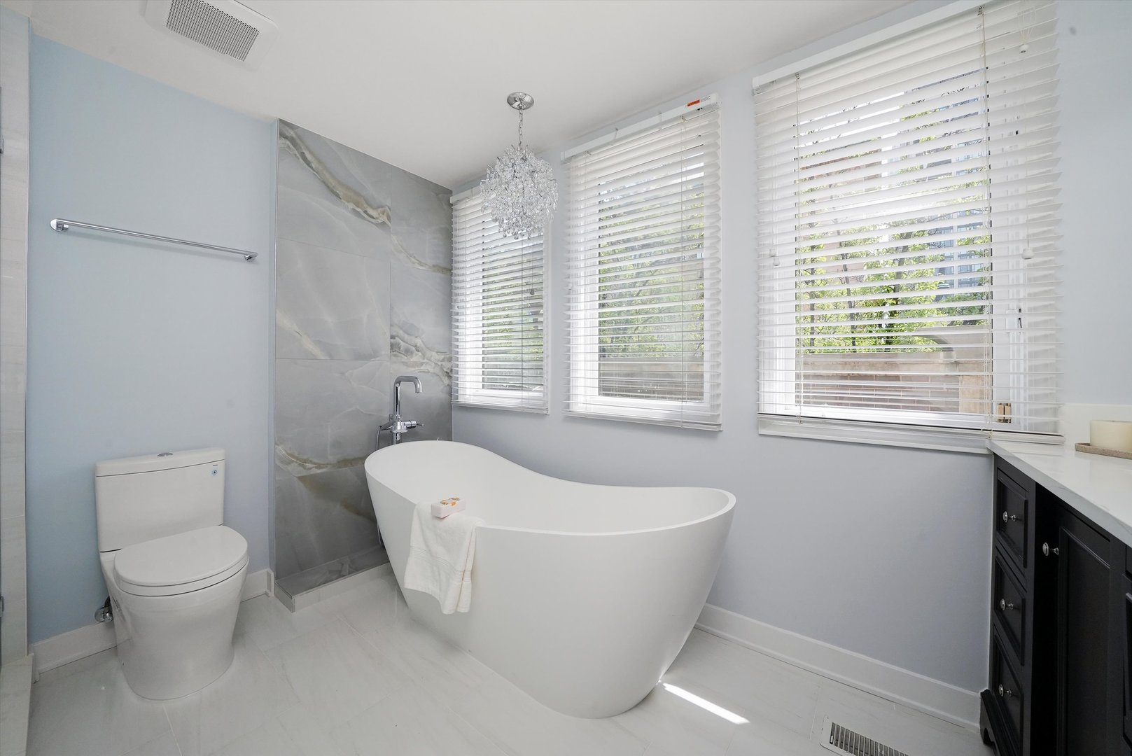 950 North Clark Street, Unit E Chicago, IL 60610 - Photo 45 of 52 a white bath tub sitting next to a toilet