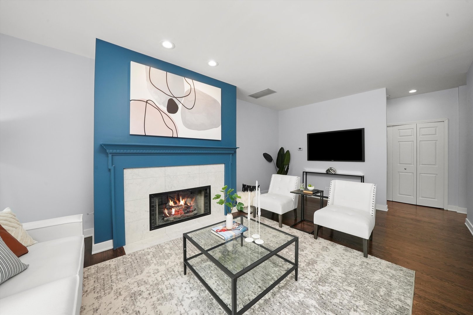 950 North Clark Street, Unit E Chicago, IL 60610 - Photo 5 of 52 a living room with furniture a flat screen tv and a fireplace