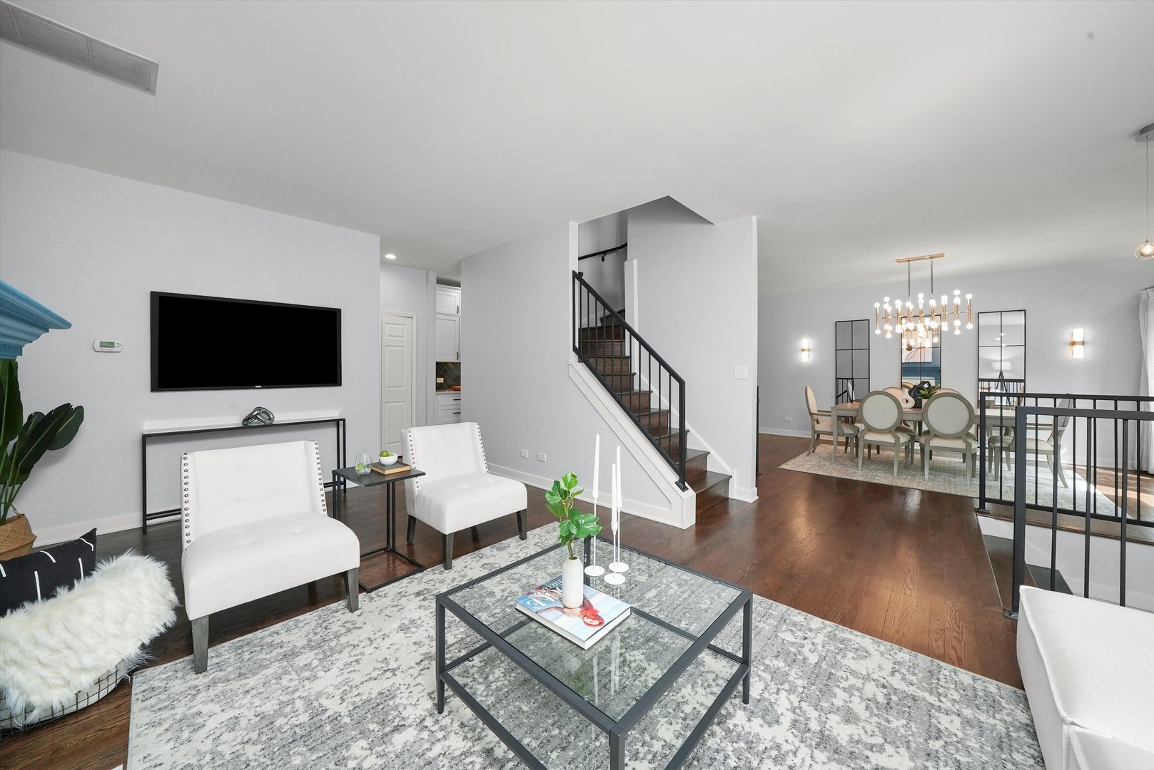 950 North Clark Street, Unit E Chicago, IL 60610 - Photo 8 of 52 a living room with furniture and a flat screen tv