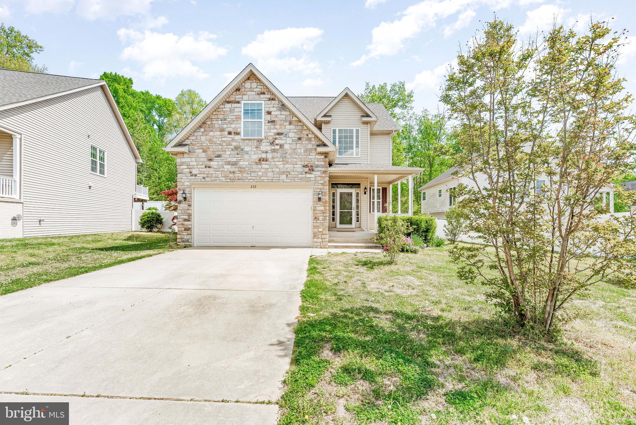 252 Rimfire Way Prince Frederick, MD 20678 - Photo 2 of 35 a front view of a house with garden
