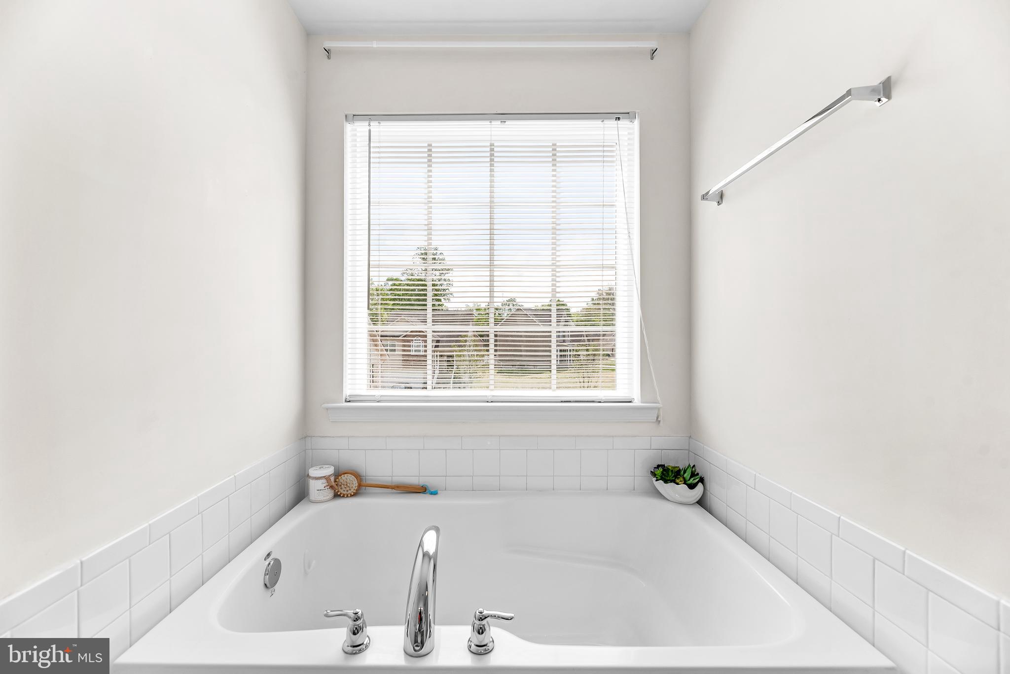 252 Rimfire Way Prince Frederick, MD 20678 - Photo 29 of 35 a white bath tub sitting next to a window