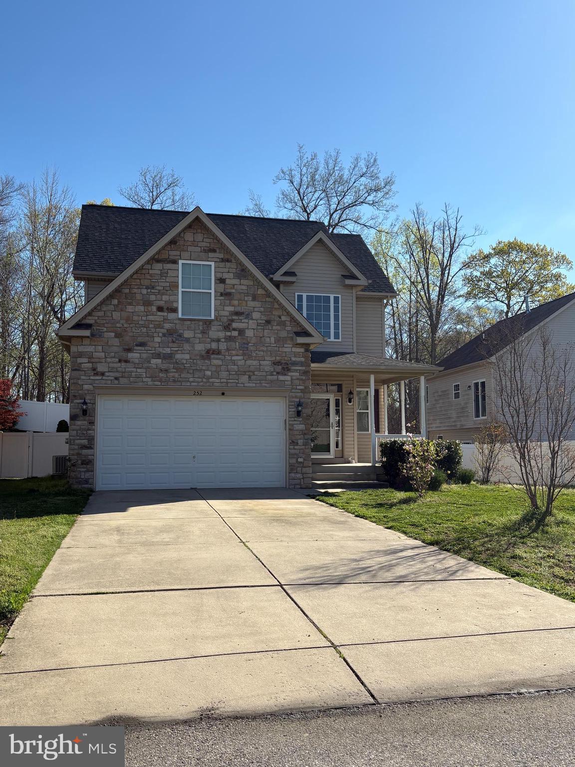 252 Rimfire Way Prince Frederick, MD 20678 - Photo 3 of 35 a front view of a house with a yard and garage