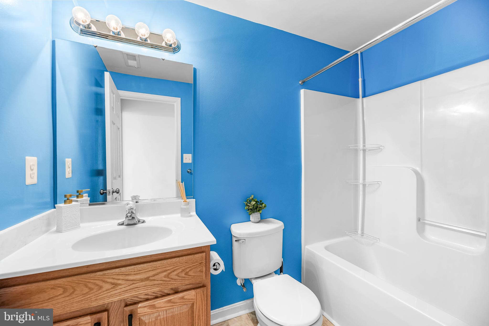 252 Rimfire Way Prince Frederick, MD 20678 - Photo 32 of 35 a bathroom with a sink toilet vanity and shower