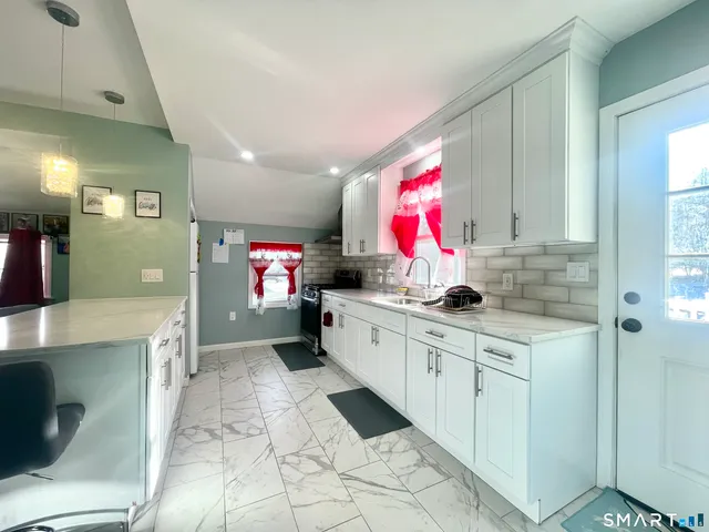 a kitchen with a sink and cabinets