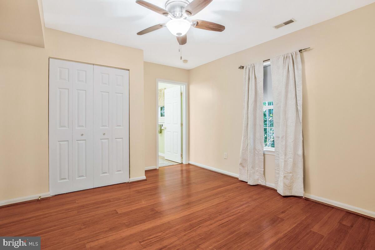 165 Ball Road St. Leonard, MD 20685 - Photo 44 of 55 a view of an empty room with wooden floor