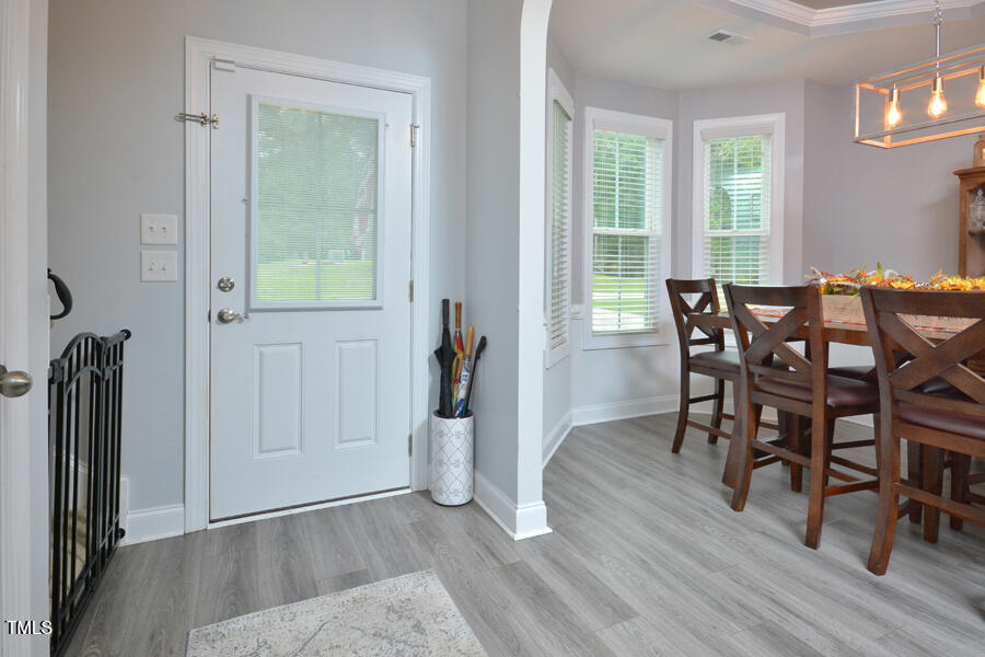 195 Timberwind Road Franklinton, NC 27525 - Photo 4 of 28 a view of a dining room with furniture and wooden floor