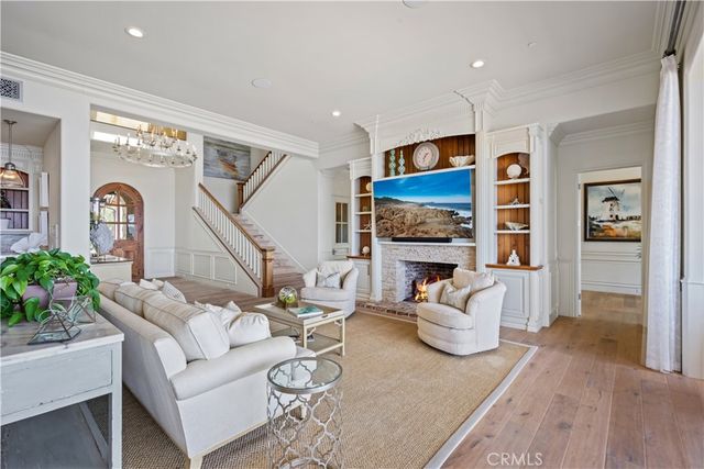 a living room with furniture flat screen tv and a fireplace