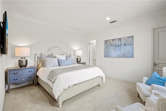 a bedroom with a bed and chair