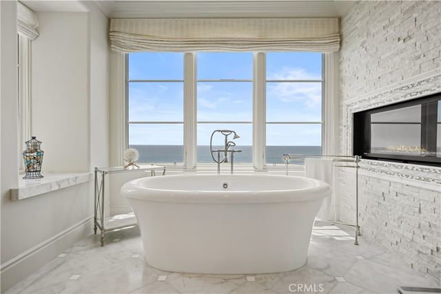 a white bath tub sitting next to a window
