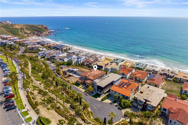 an aerial view of residential building with ocean view
