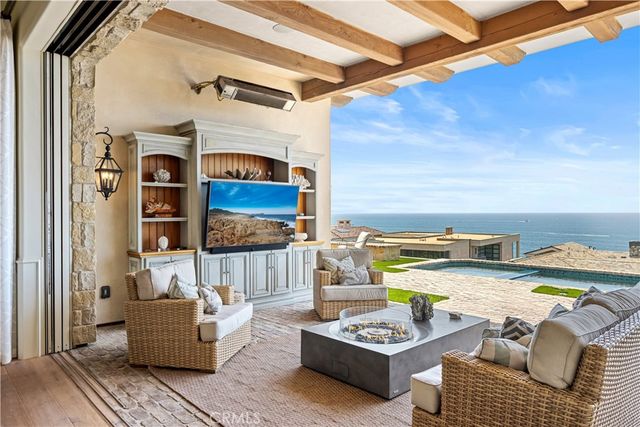 a view of a patio with couches and potted plants