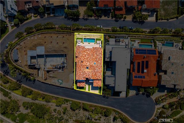 a view of a brick building next to a yard
