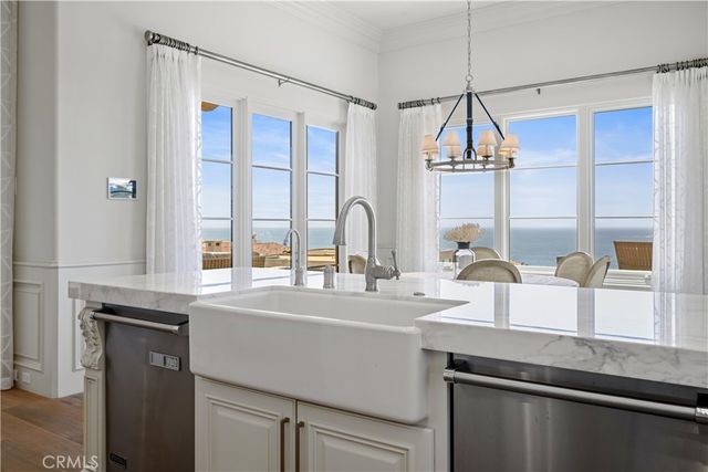 a kitchen with stainless steel appliances a sink and a window