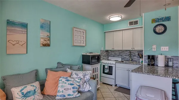 a kitchen with a refrigerator and a sink