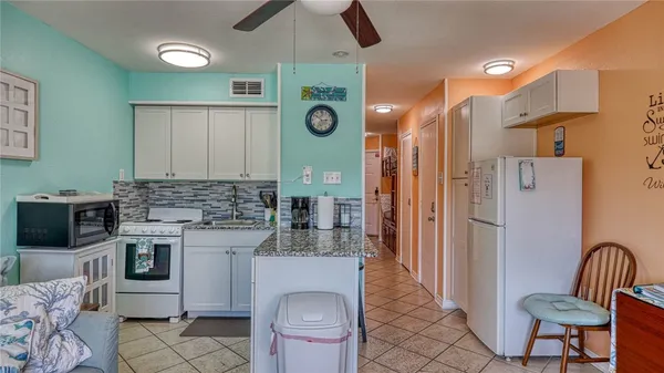 a view of roof deck with sitting area