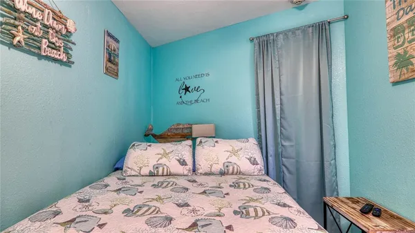 a bedroom with a bed and a cabinets