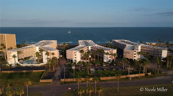 a bathroom with a toilet a sink and shower
