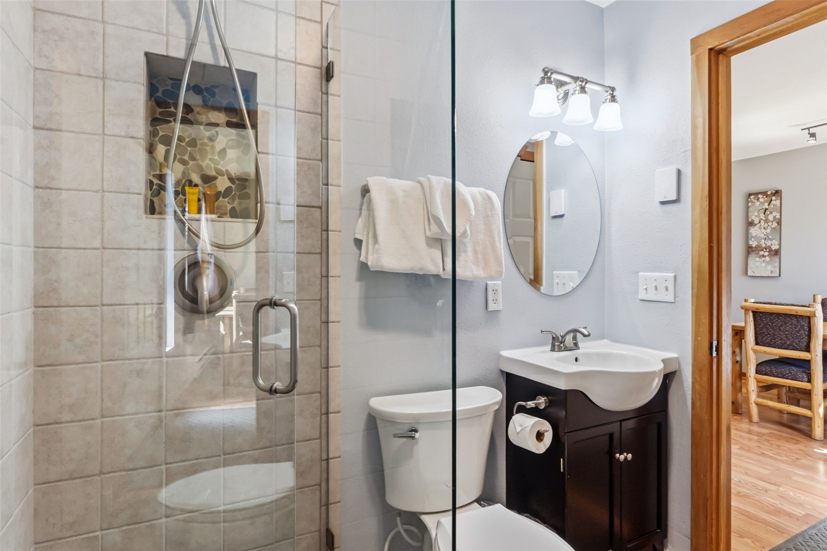 6734 Ryan Gulch Road, Unit 6734 Silverthorne, CO 80498 - Photo 27 of 33 a bathroom with a toilet sink and mirror