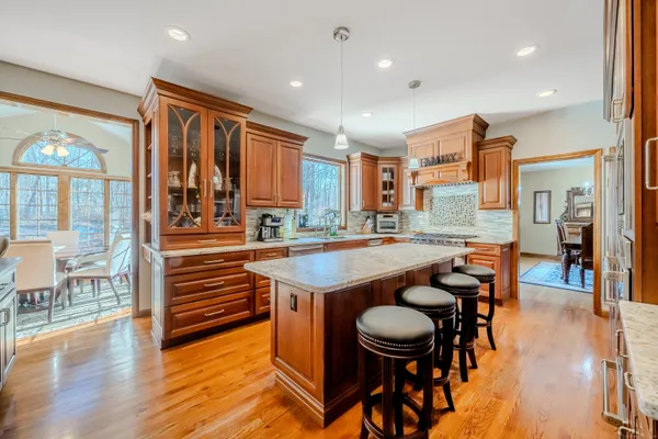 an open kitchen with a table and chairs in it