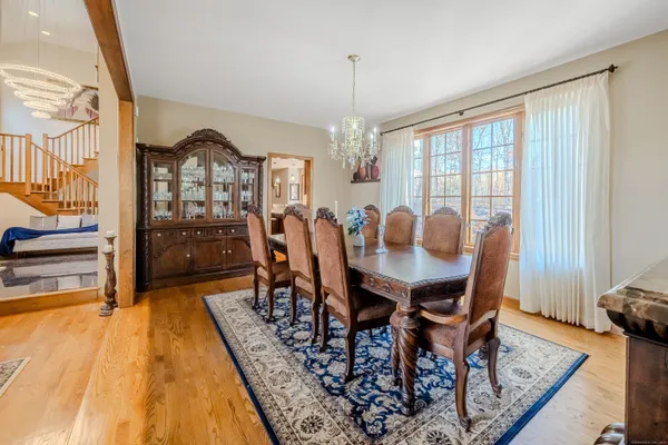 a view of a dining room with furniture window and wooden floor