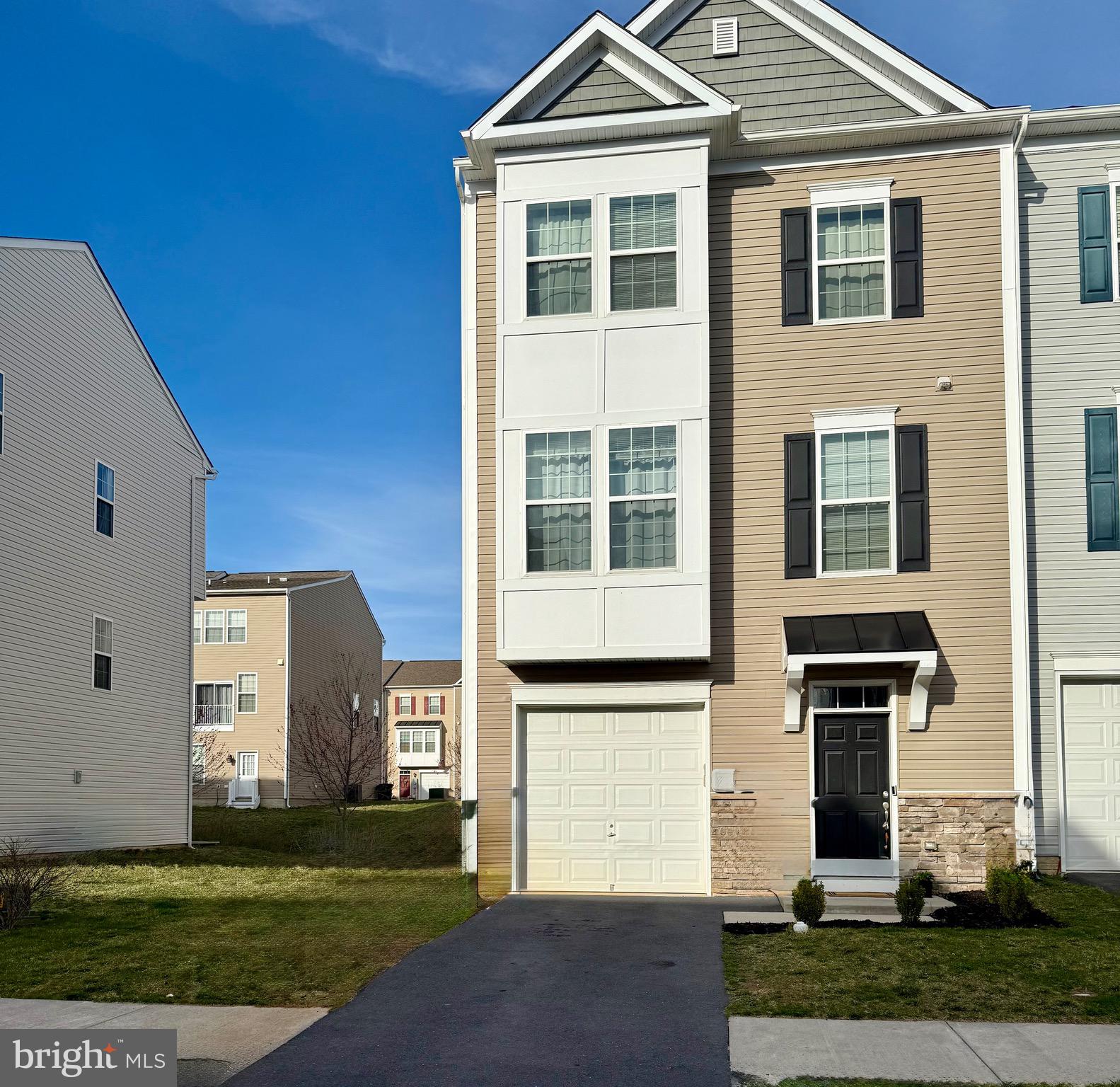 a front view of a house with a yard