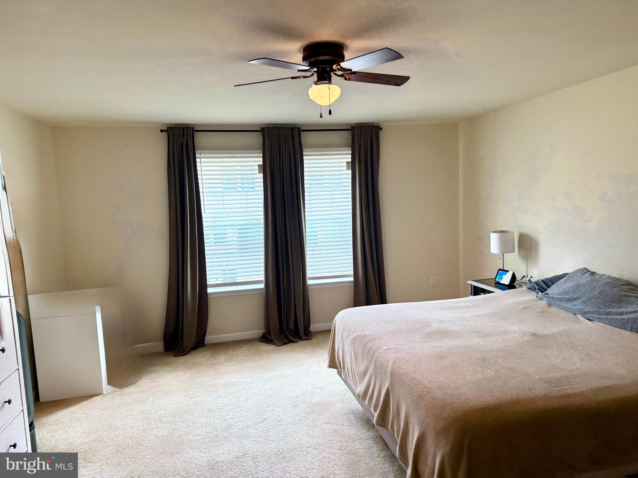 236 Schramm Loop Stephens City, VA 22655 - Photo 15 of 26 a bedroom with a bed and a chandelier