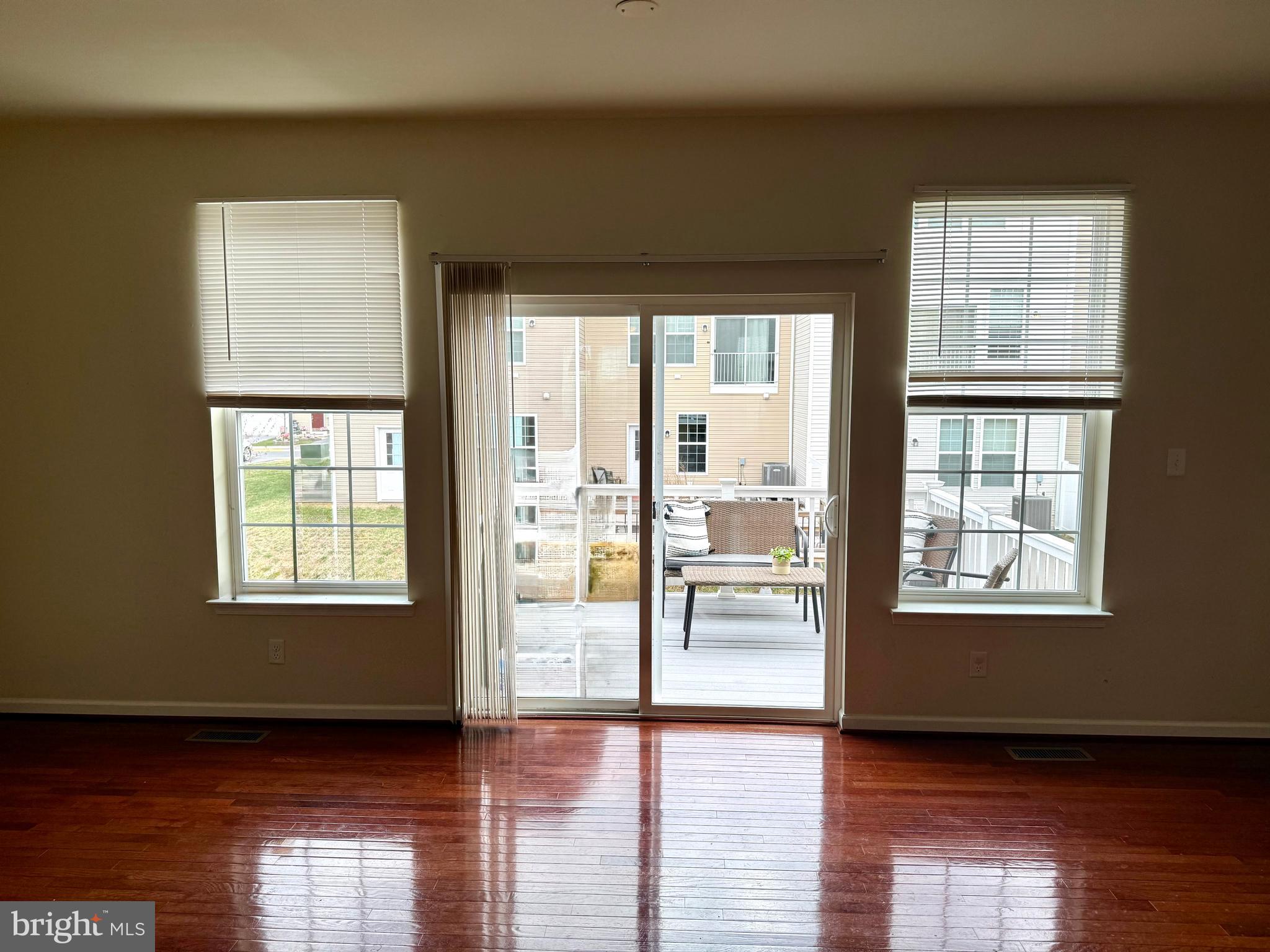 236 Schramm Loop Stephens City, VA 22655 - Photo 8 of 26 a view of an empty room with wooden floor and a window