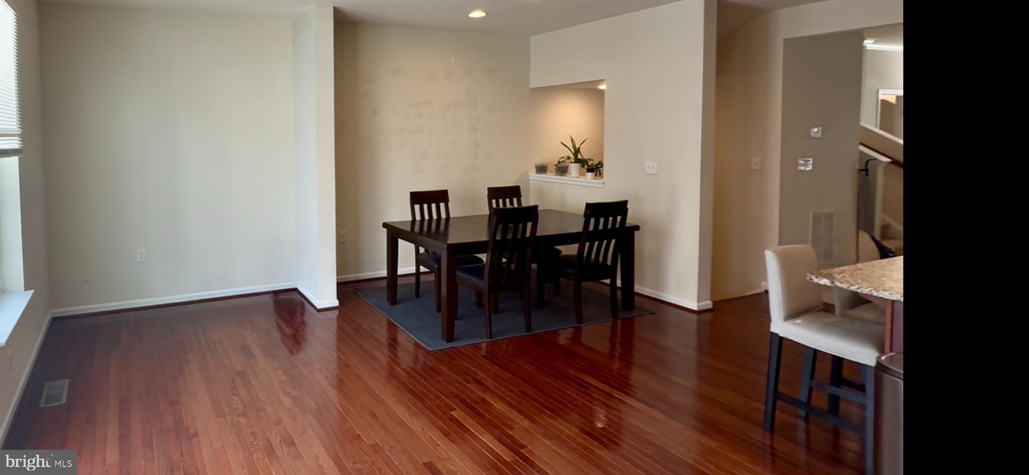 236 Schramm Loop Stephens City, VA 22655 - Photo 9 of 26 a view of a dining room with furniture and wooden floor