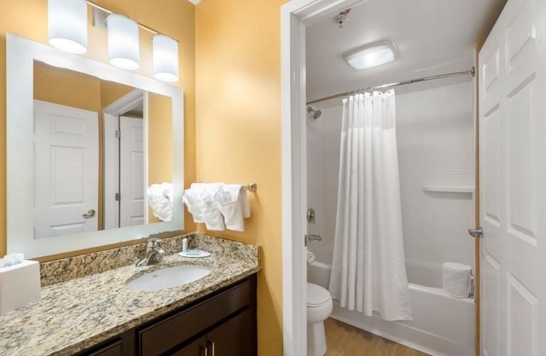 20 International Place, Unit 310 Tewksbury, MA 01876 - Photo 14 of 27 a bathroom with a granite countertop sink and a mirror