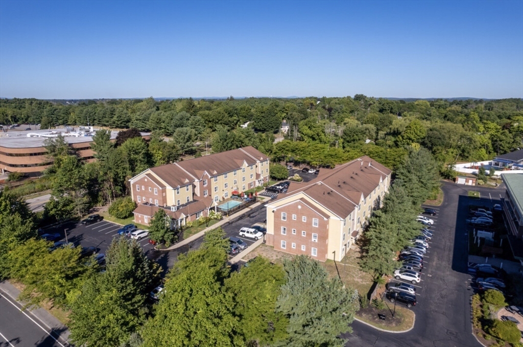 20 International Place, Unit 310 Tewksbury, MA 01876 - Photo 20 of 27 an aerial view of a house with a yard