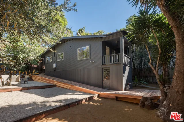 a backyard of a house with seating space