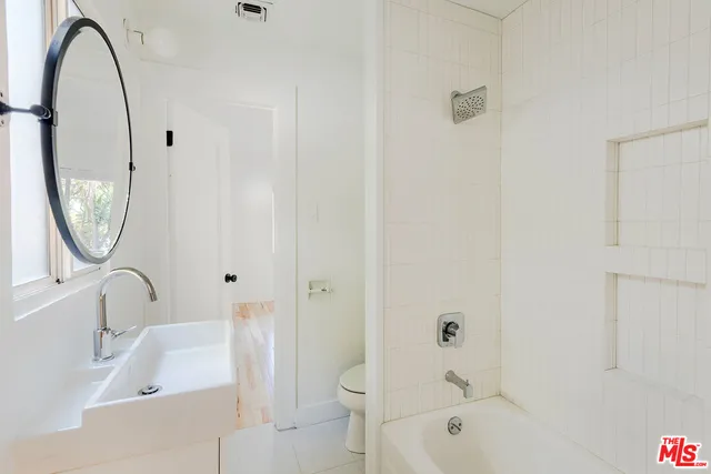 a bathroom with a sink toilet and a bathtub