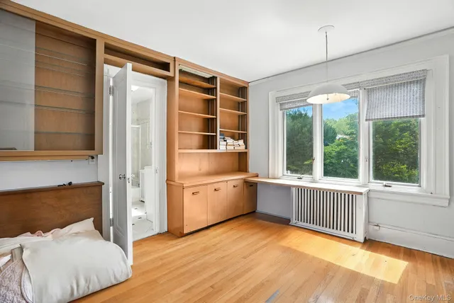 a bathroom with a tub sink and shower