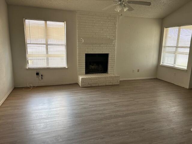 2007 South Loop 289 Lubbock, TX 79423 - Photo 4 of 8 an empty room with wooden floor and windows