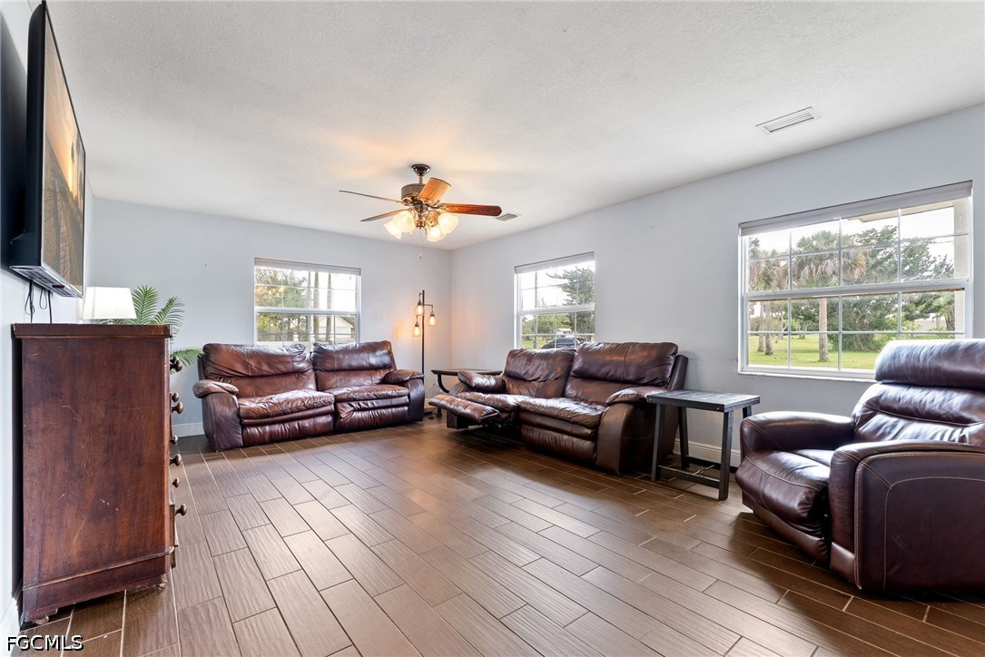 17290 Rewis Road Alva, FL 33920 - Photo 7 of 50 a living room with furniture and a flat screen tv