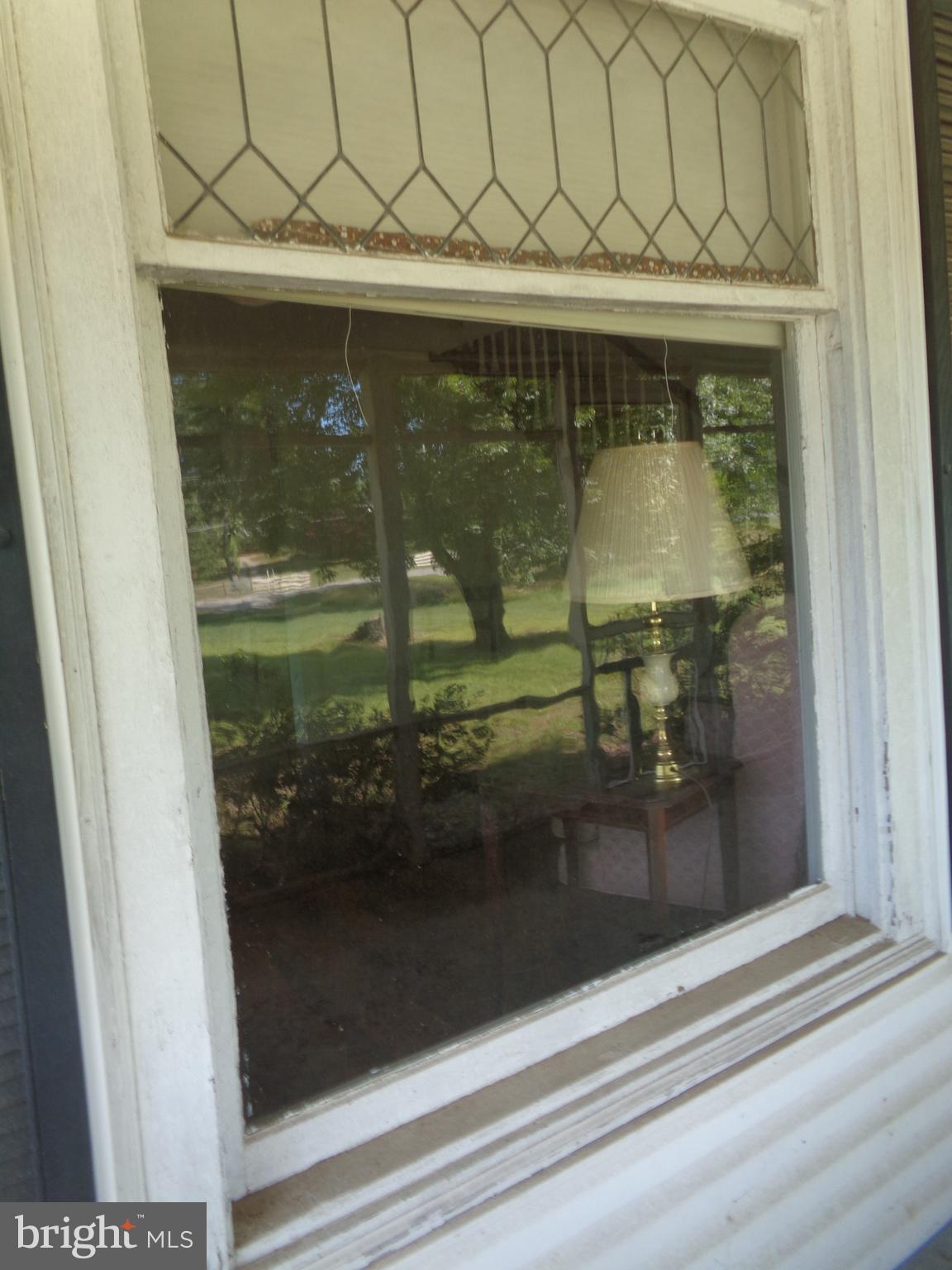 9145 Mackall Road St. Leonard, MD 20685 - Photo 15 of 48 One of the 2 original old rolled glass windows.